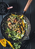 Stir-fried prawns and vegetables with mango and lime