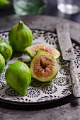Fresh green figs on a ceramic plate