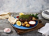 Slow-roast shoulder of lamb with a herb crust (Greece)