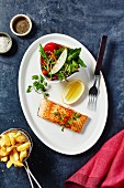 Salmon with chips and salad