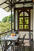 Summery loggia in half-timbered house with arched window