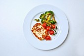 Halloumi cheese with spicy broccoli and vine tomatoes