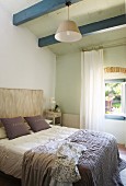 Blue ceiling beams in Mediterranean bedroom
