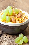 Cornflakes with almonds and grapes