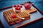 Waffles with raspberries and strawberry coulis