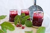 Raspberry jam in upside-down jars