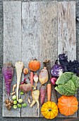 Assorted winter vegetables in a wooden board