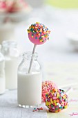 Colorful cake pops and milk