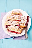 Puff pastry strudel with cherries and föaked almonds