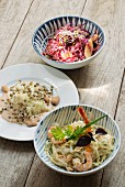 Three types of cabbage salad with red cabbage, white cabbage and sauerkraut