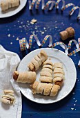 Sausages wrapped in puff pastry for New Year's Eve