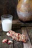 Healthy oat biscuits with dried cranberries and a glass of milk