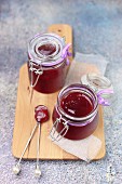 Red fruit jam in two glass jars