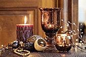 Christmas arrangement with moulded candles and mercury-glass candle lanterns
