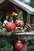 Bird table festively decorated with baubles