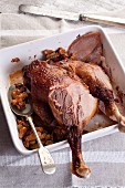 Roast legs of goose with raisins and walnuts