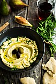 A meal with old biblical ingredients: hummus, flatbread and figs