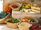 A Mediterranean arrangement of vegetables, citrus fruits and melons