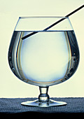 Rod refracted in a glass of water