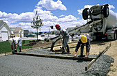Workers Pour Concrete