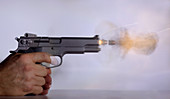 Handgun and .45 Caliber Bullet Double Exp