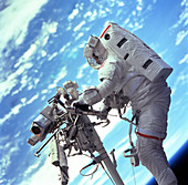 Shuttle astronaut on remote manipulator s
