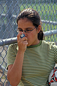 Girl Using Inhaler