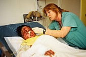 Nurse Tending to Burn Victim