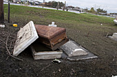 Caskets Emerge from Flooding