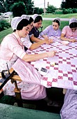 Amish women quilting