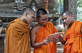Young Monks using IPad,Cambodia