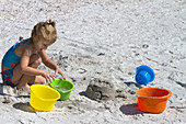Girl Playing in Sand