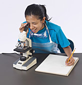 Student Viewing Lichen in Microscope