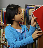 8 Year Old Girl in a Library