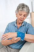 Older woman with swollen wrist
