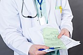 Doctor with health insurance form