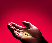 Golden drug capsule,conceptual image