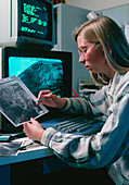 Meteorologist studying satellite imagery