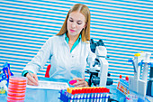 Lab assistant holding sample