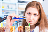 Lab technician testing legumes in lab