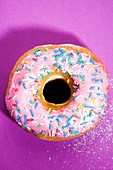 Pink doughnut with sprinkles