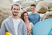 Young adults with surfboard