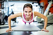 Young woman doing press-ups