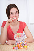 Teenage girl with large bag of sweets
