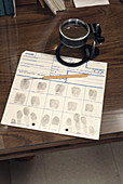 Fingerprint card with magnifying glass