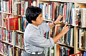 Schoolboy in a library