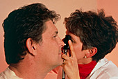 Doctor examining AIDS patient