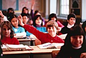 Down's syndrome child working with her class