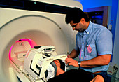 Patient about to enter high-speed MRI scanner