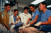 Hospital trauma team at work on emergency patient